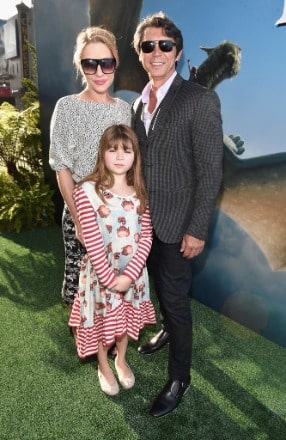 Indigo Sanara Phillips posing with her parents for a photoshoot.